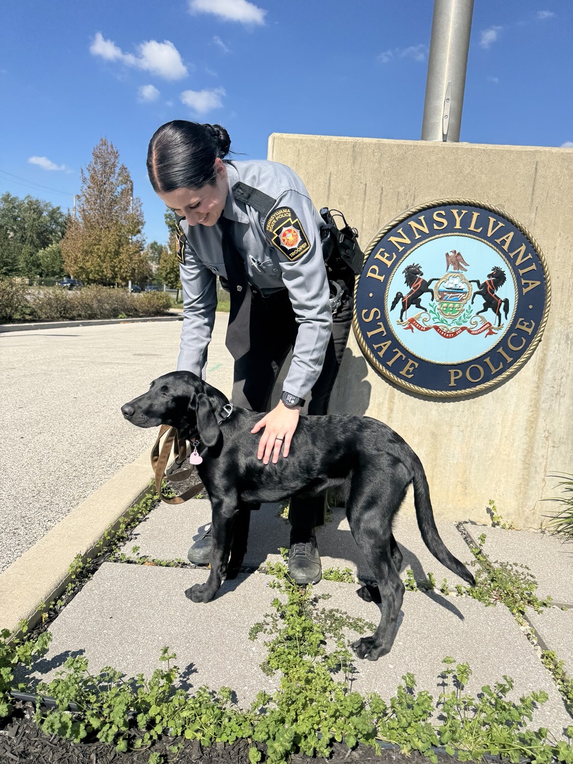 Therapy dog with first responders during department support visit